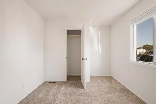 an empty room with windows