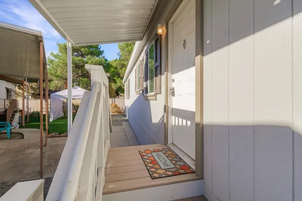 a view of balcony with furniture