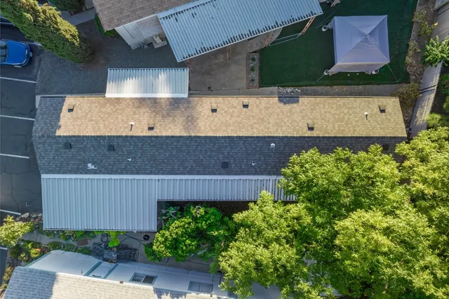 an aerial view of a house with a garden