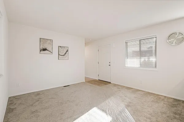 a view of an empty room with a window