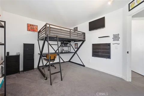a view of an empty room with workspace and window