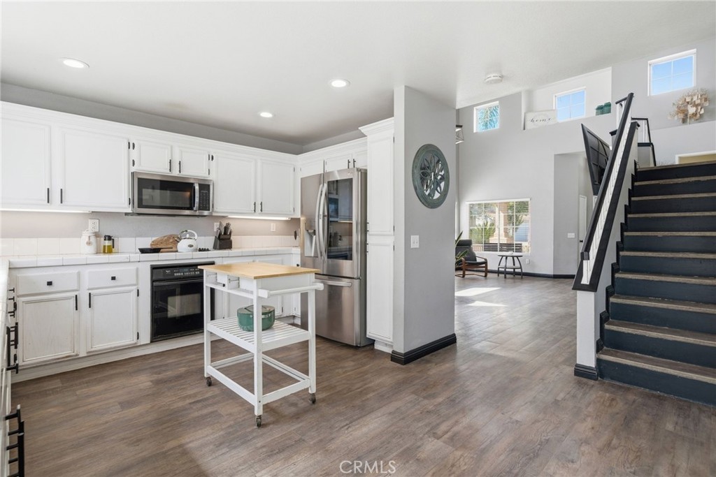 855 Viewtop Circle Corona, CA 92881 - Photo 9 of 52 a kitchen with a refrigerator and a stove top oven