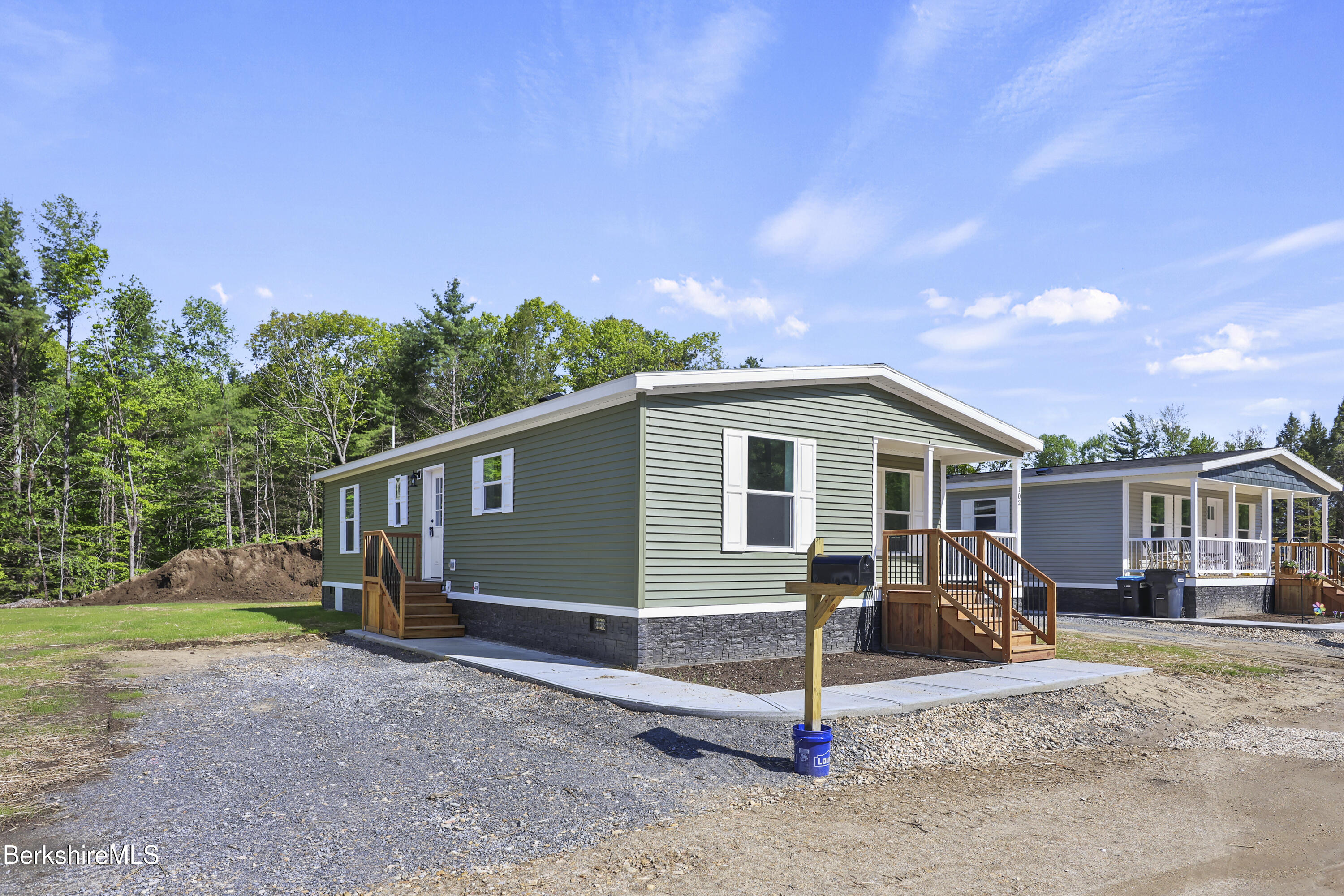 395 Cheshire Road, Unit 102 Pittsfield, MA 01201 - Photo 3 of 28 a view of a house with backyard