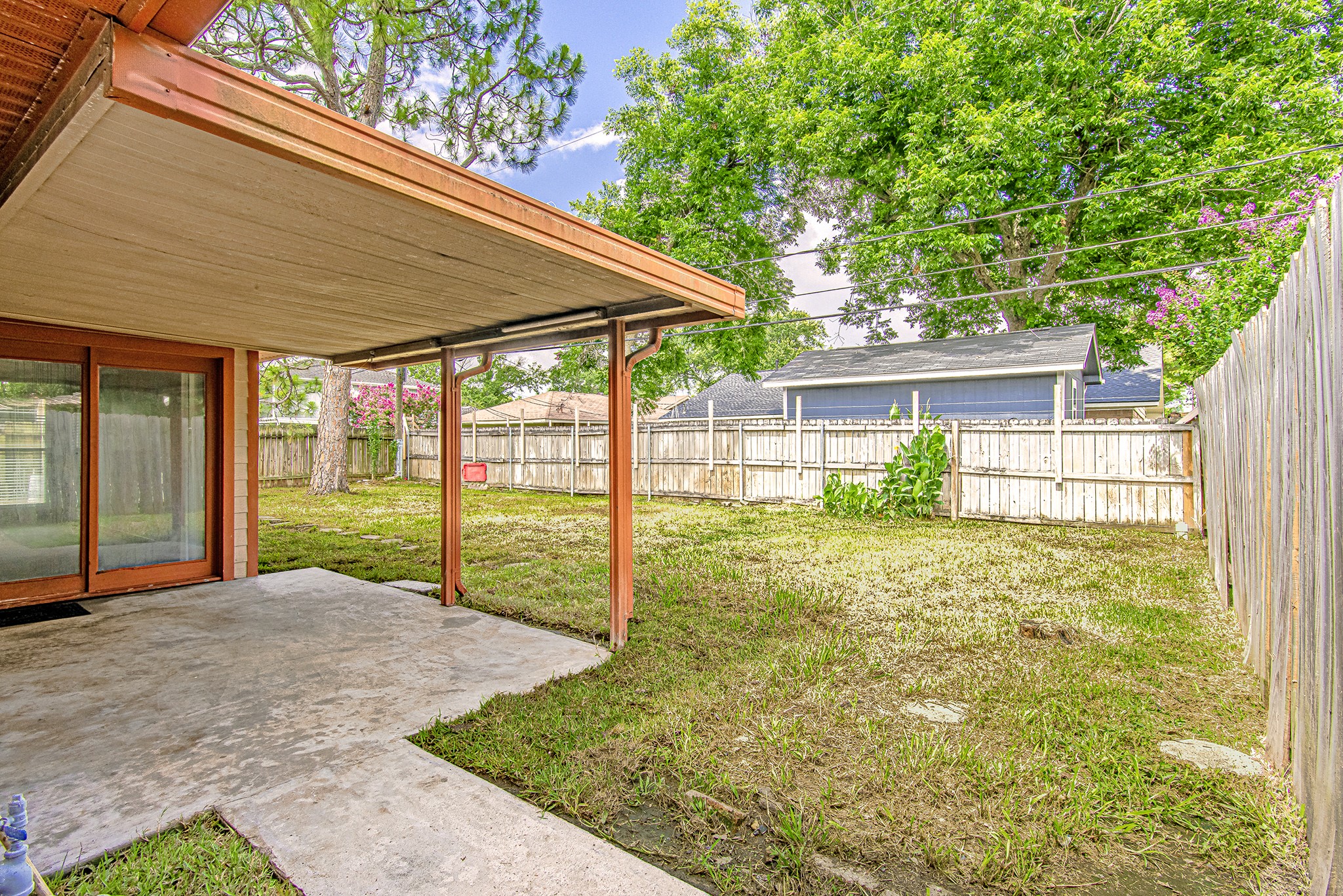 2710 Burke Road Pasadena, TX 77502 - Photo 26 of 28 Backyard view showcasing covered patio and outdoor living space
