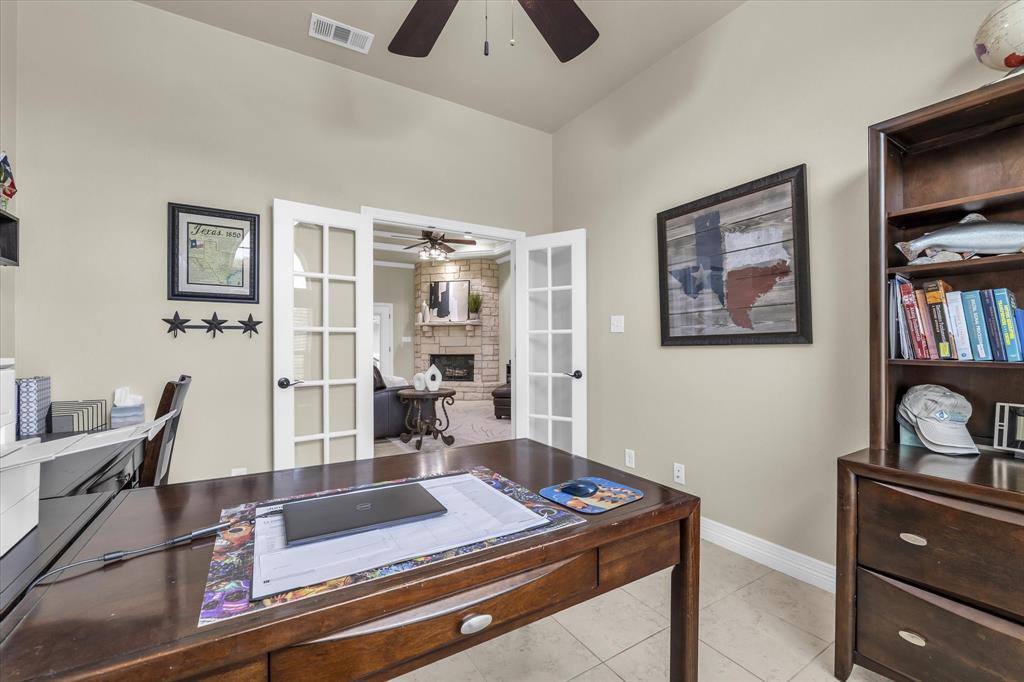 910 Springdale Lane Lorena, TX 76655 - Photo 23 of 39 Dedicated room featuring double French doors, light-toned wall paint, and tile flooring