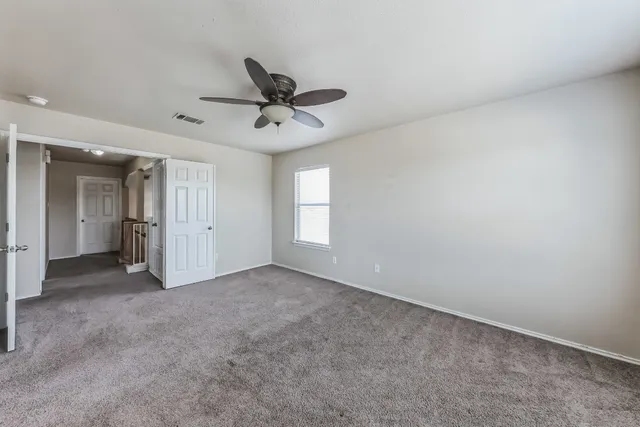 an empty room with a empty space and windows