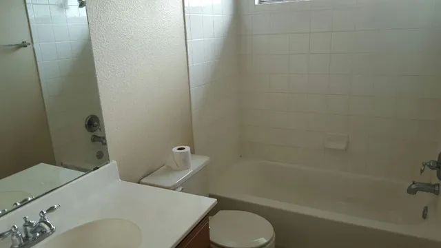 a bathroom with a sink and toilet