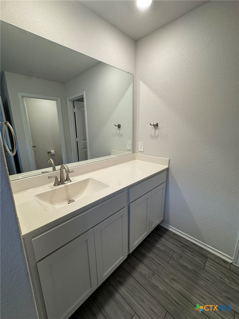 208 Ida Loop Seguin, TX 78155 - Photo 13 of 16 a bathroom with a double vanity sink and mirror