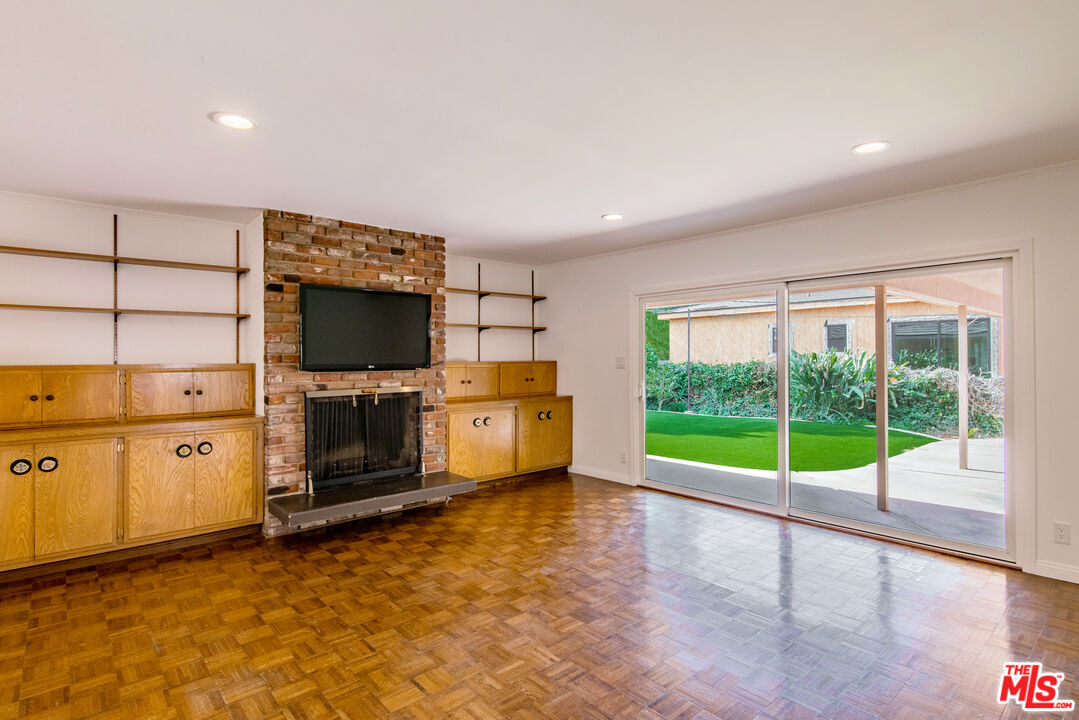 13104 West Magnolia Boulevard Sherman Oaks, CA 91423 - Photo 12 of 27 a view of a kitchen with microwave and furniture