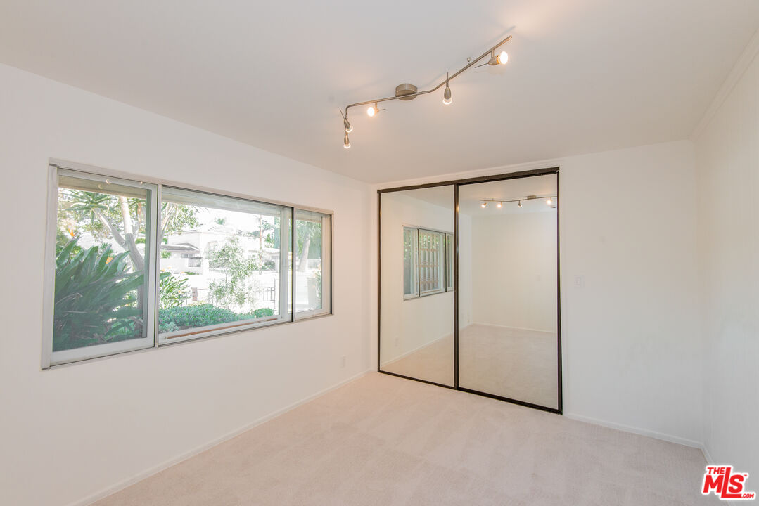 13104 West Magnolia Boulevard Sherman Oaks, CA 91423 - Photo 21 of 27 a view of an empty room with a window