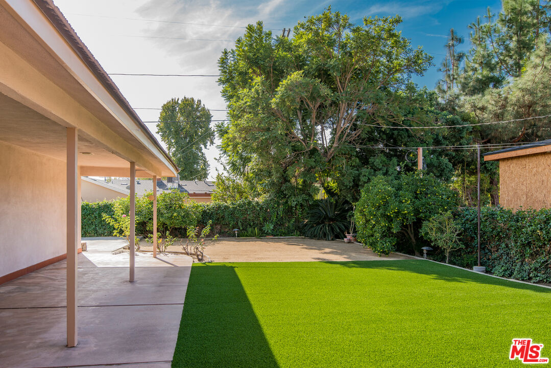 13104 West Magnolia Boulevard Sherman Oaks, CA 91423 - Photo 24 of 27 a view of a swimming pool with a patio