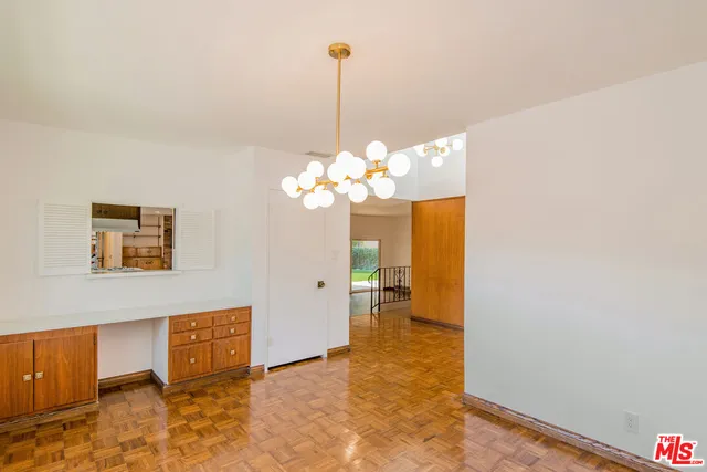 a view of a hallway with a chandelier
