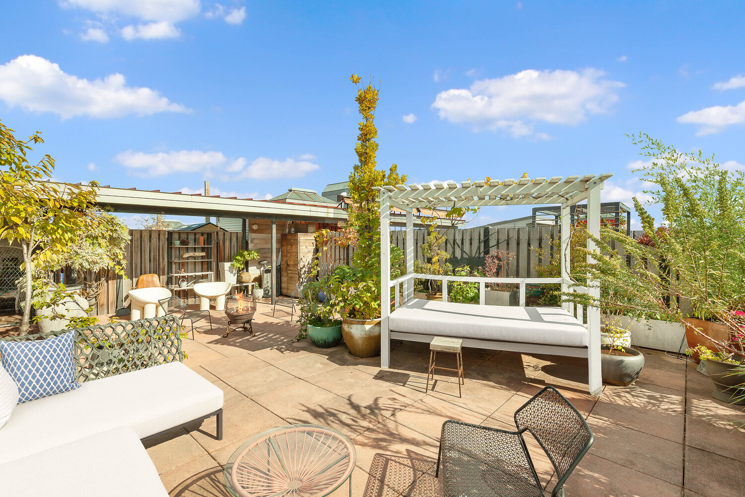85 North 3rd Street, Unit 510 Brooklyn, NY 11249 - Photo 10 of 18 a view of a patio with couches table and chairs and potted plants