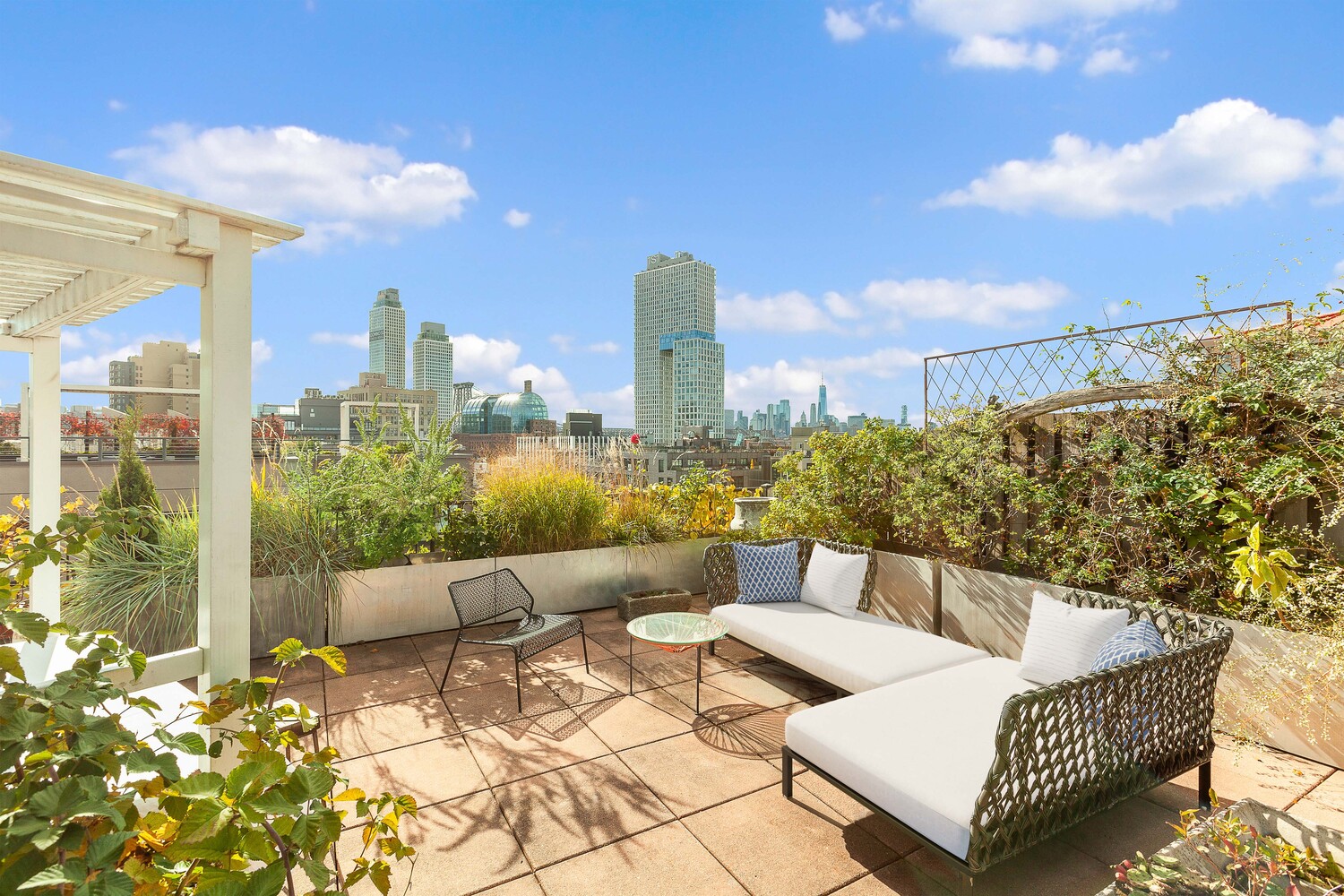 85 North 3rd Street, Unit 510 Brooklyn, NY 11249 - Photo 12 of 18 a view of a terrace with furniture and city view