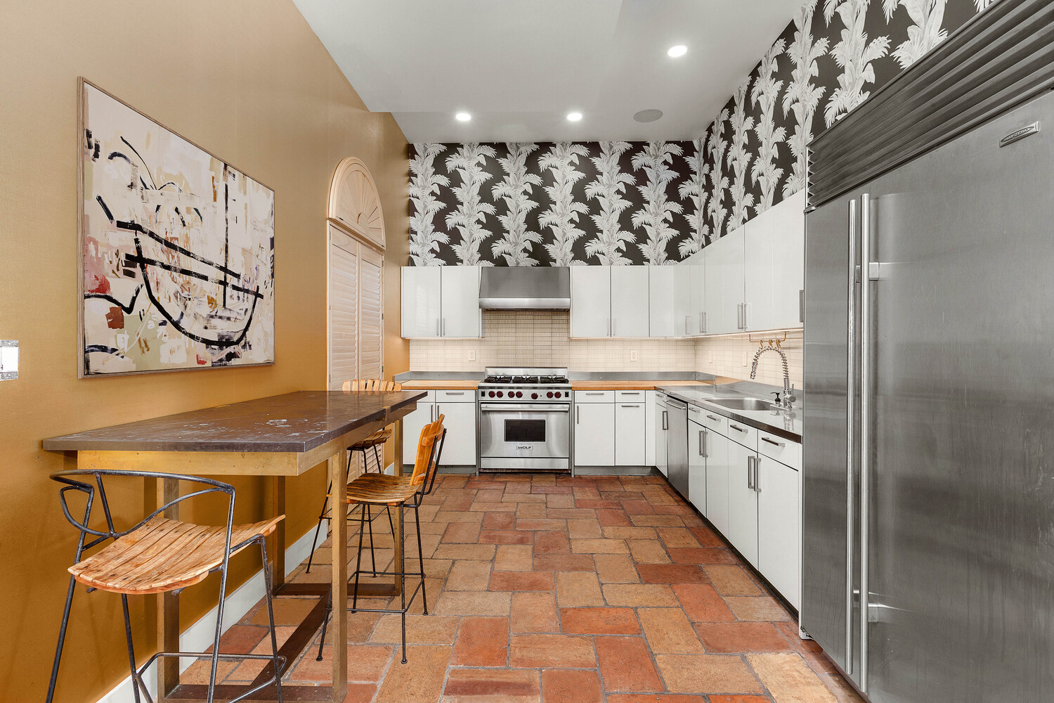 85 North 3rd Street, Unit 510 Brooklyn, NY 11249 - Photo 4 of 18 a kitchen with stainless steel appliances granite countertop a stove a sink and a refrigerator