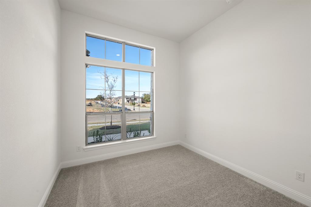 701 Seahawk Street Joshua, TX 76058 - Photo 17 of 30 a view of a room that has a window in it