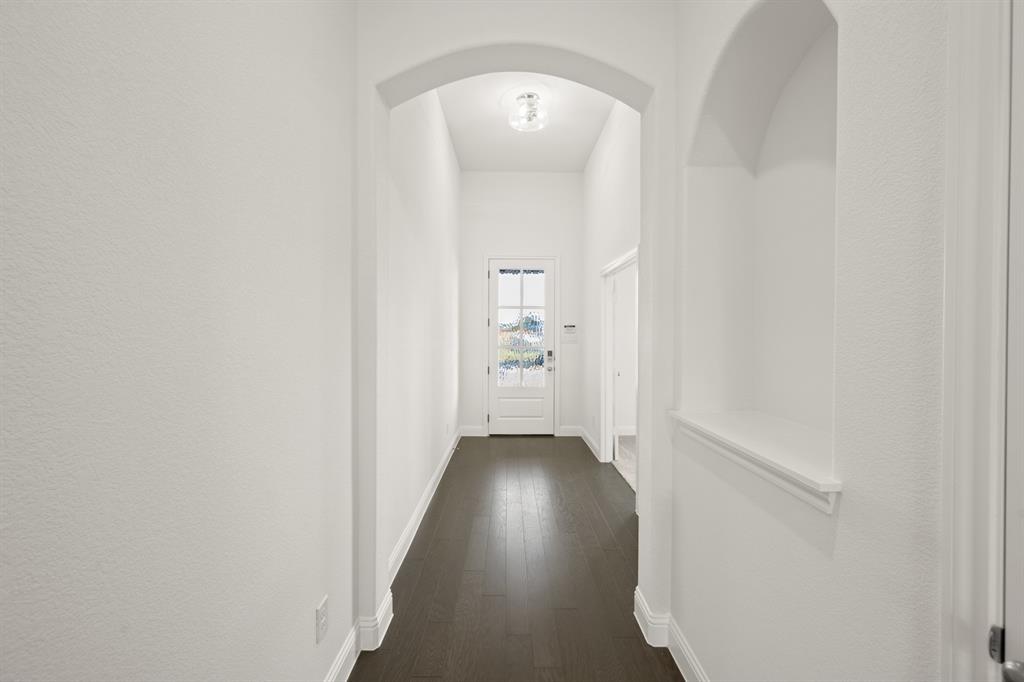 701 Seahawk Street Joshua, TX 76058 - Photo 22 of 30 a view of a hallway with wooden floor