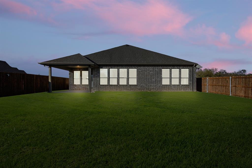 701 Seahawk Street Joshua, TX 76058 - Photo 25 of 30 a front view of a house with a yard