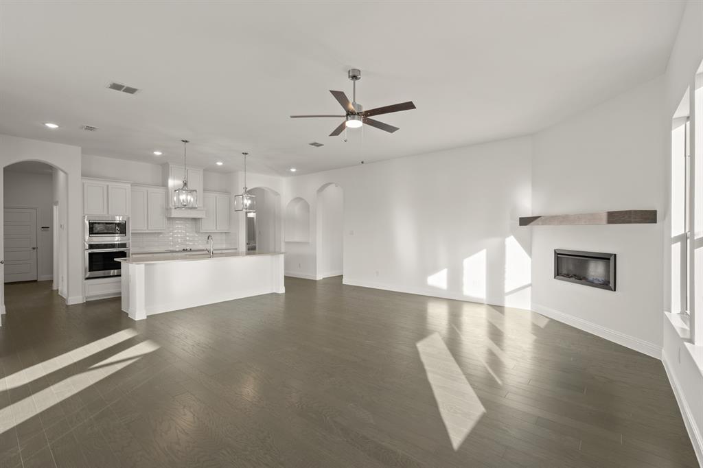 701 Seahawk Street Joshua, TX 76058 - Photo 7 of 30 a view of an empty room with kitchen appliances and a kitchen view