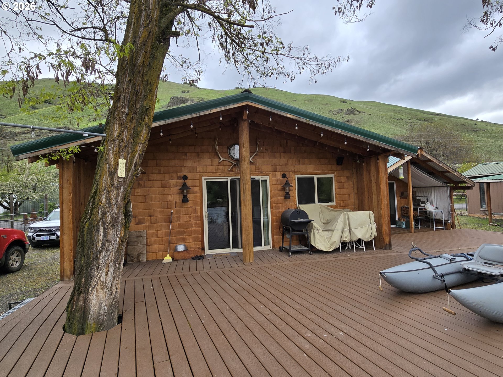 84665 Grande Ronde Road Enterprise, OR 97828 - Photo 1 of 27 a front view of a house with garden