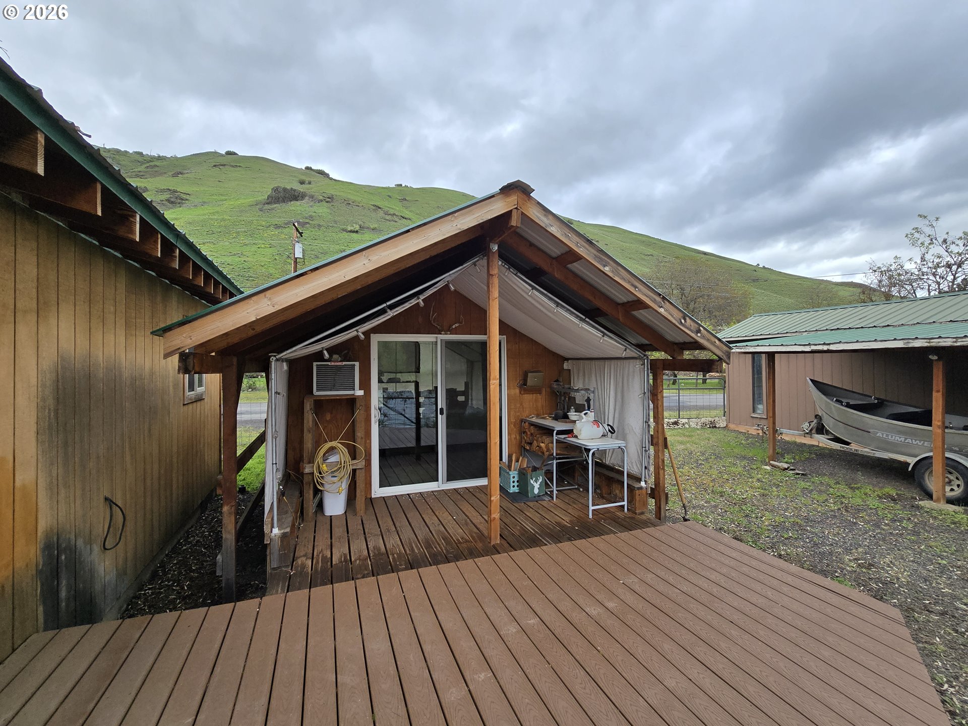 84665 Grande Ronde Road Enterprise, OR 97828 - Photo 16 of 27 a view of a house with backyard and porch