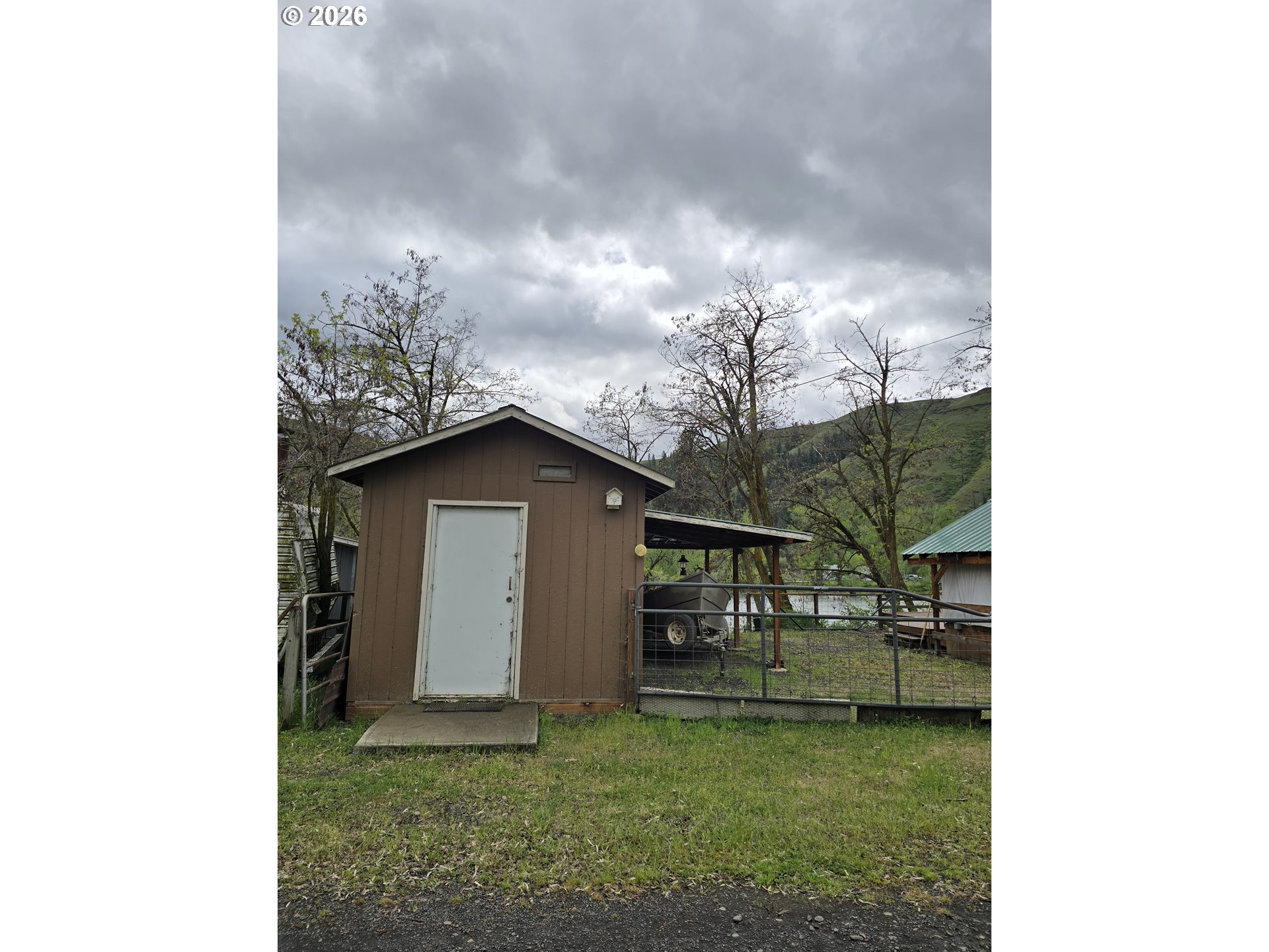 84665 Grande Ronde Road Enterprise, OR 97828 - Photo 21 of 27 a view of a small house with a yard