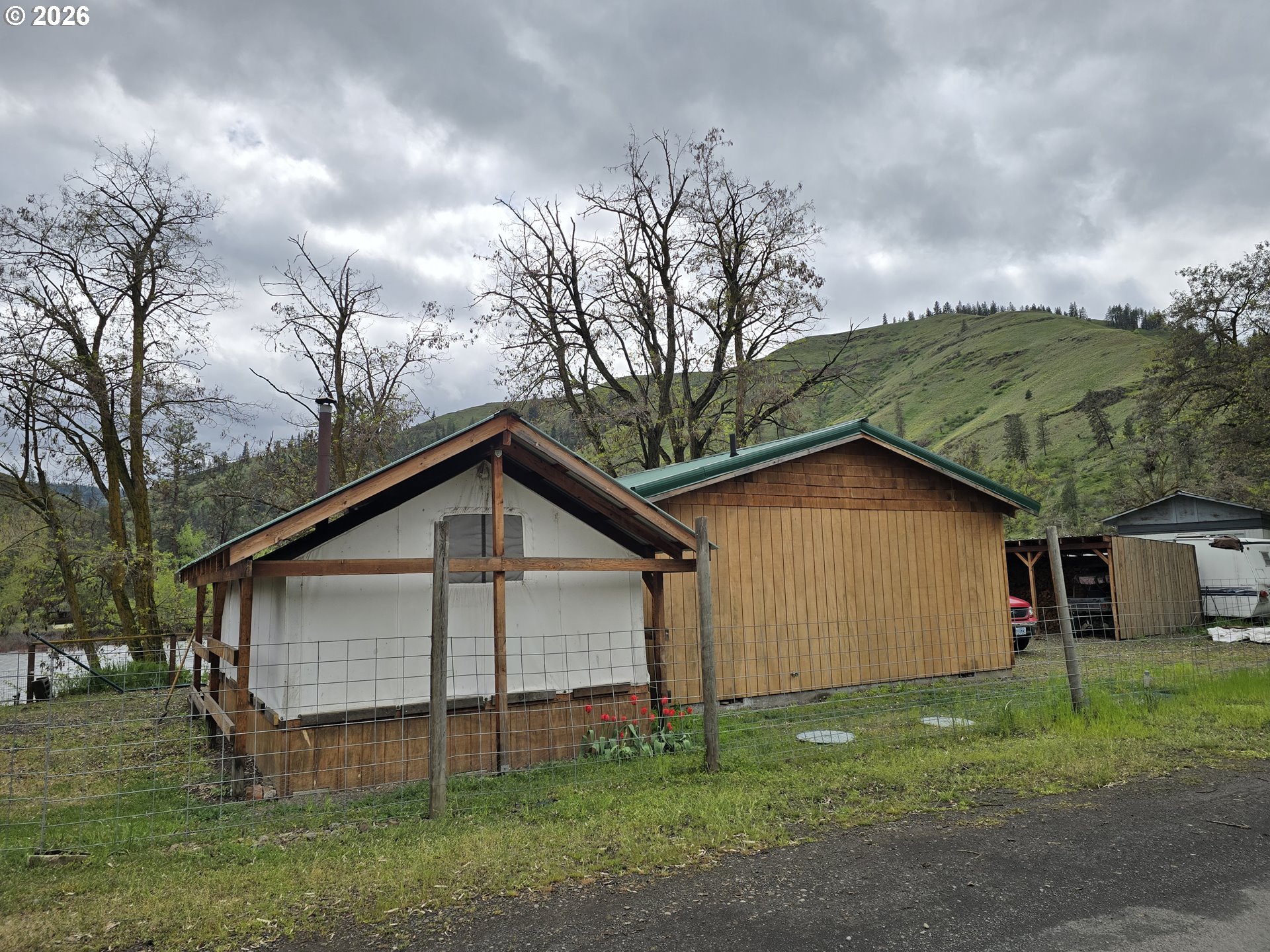 84665 Grande Ronde Road Enterprise, OR 97828 - Photo 22 of 27 a view of a house with a yard and large tree