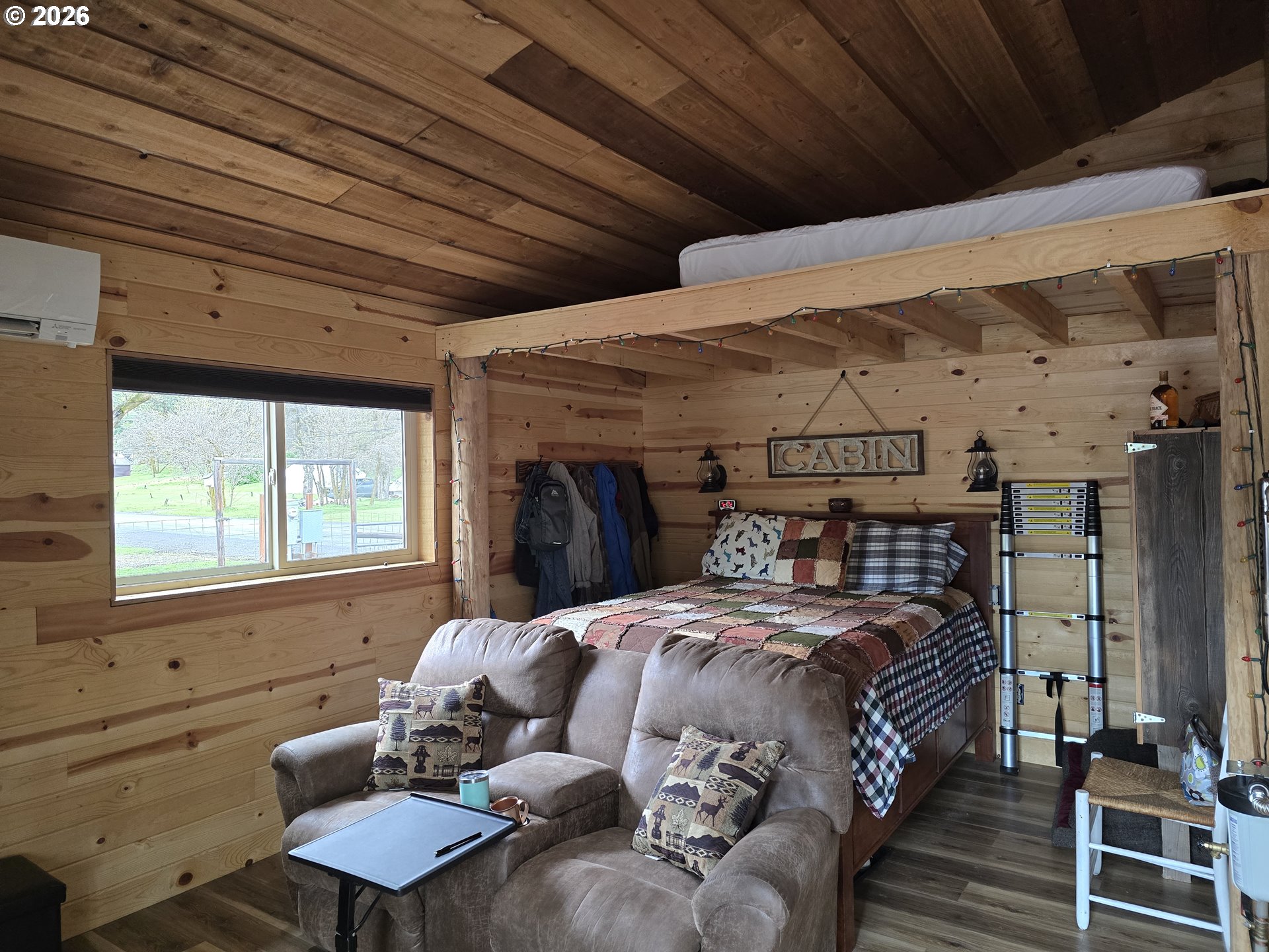 84665 Grande Ronde Road Enterprise, OR 97828 - Photo 10 of 27 a bedroom with furniture and a window
