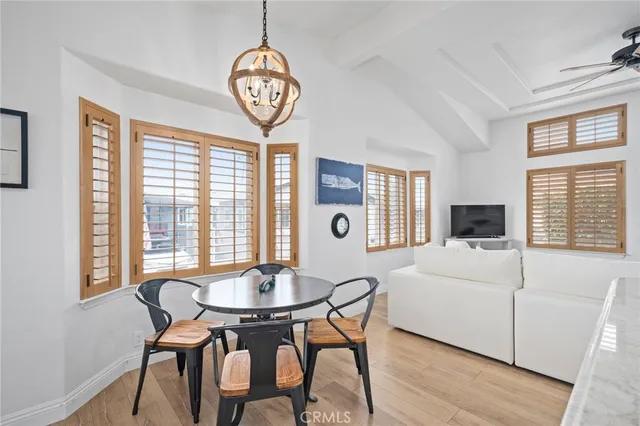 a view of a house with wooden fence