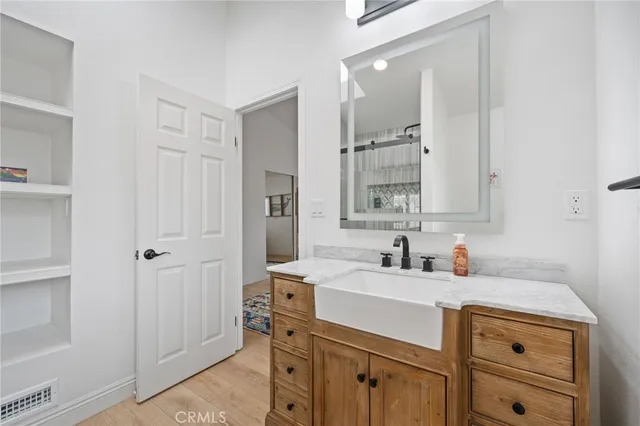 a view of a fan and a wooden floor