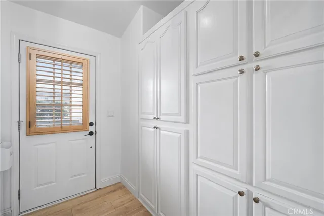 an aerial view of a city with ocean view in back