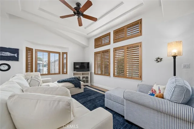 a living room with furniture a couch and a lamp