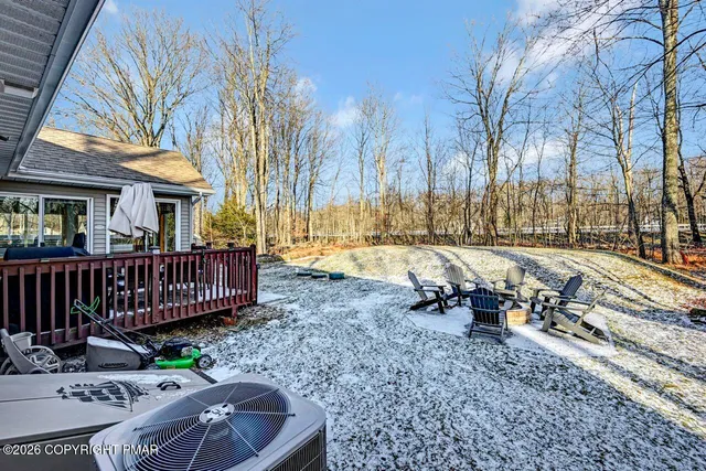 a view of a chair and tables in the backyard