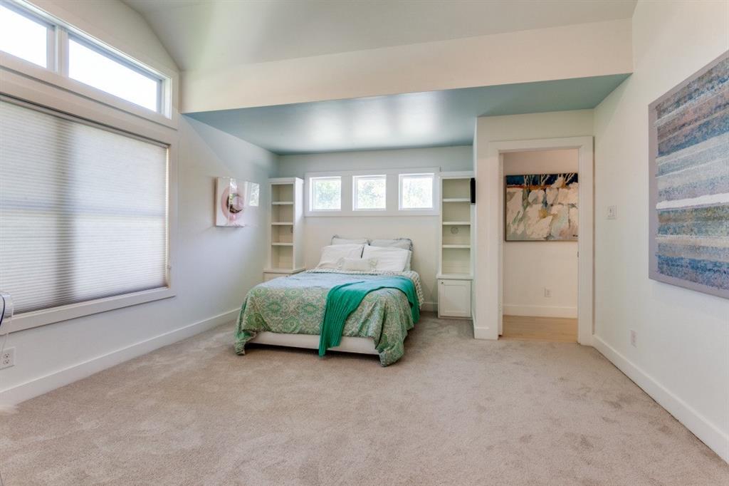 4206 Manning Lane Dallas, TX 75220 - Photo 26 of 35 a bedroom with a large bed and a window