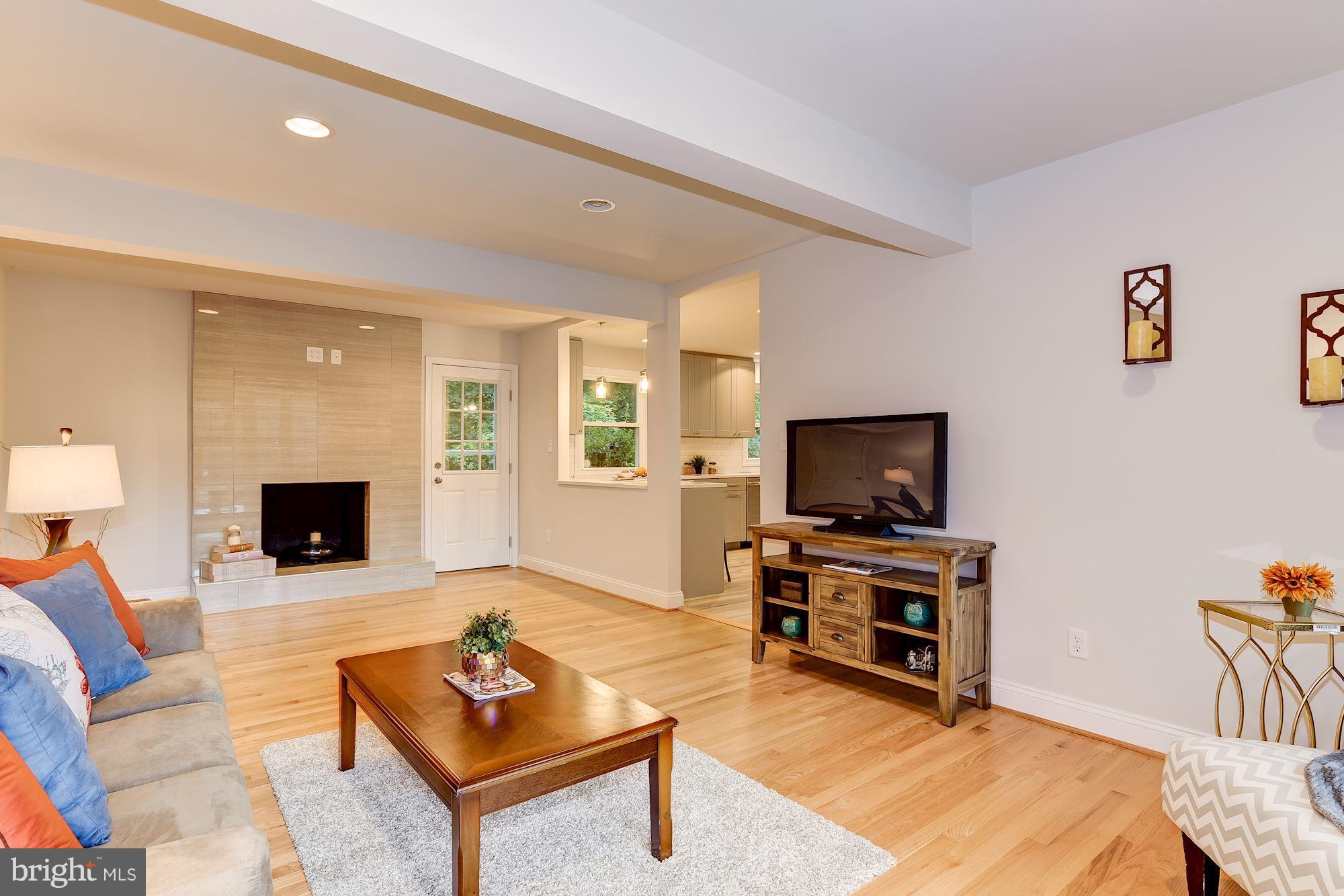 2209 Forest Ridge Road Lutherville-Timonium, MD 21093 - Photo 13 of 30 Family Room off kitchen. Fireplace. Door to yard.