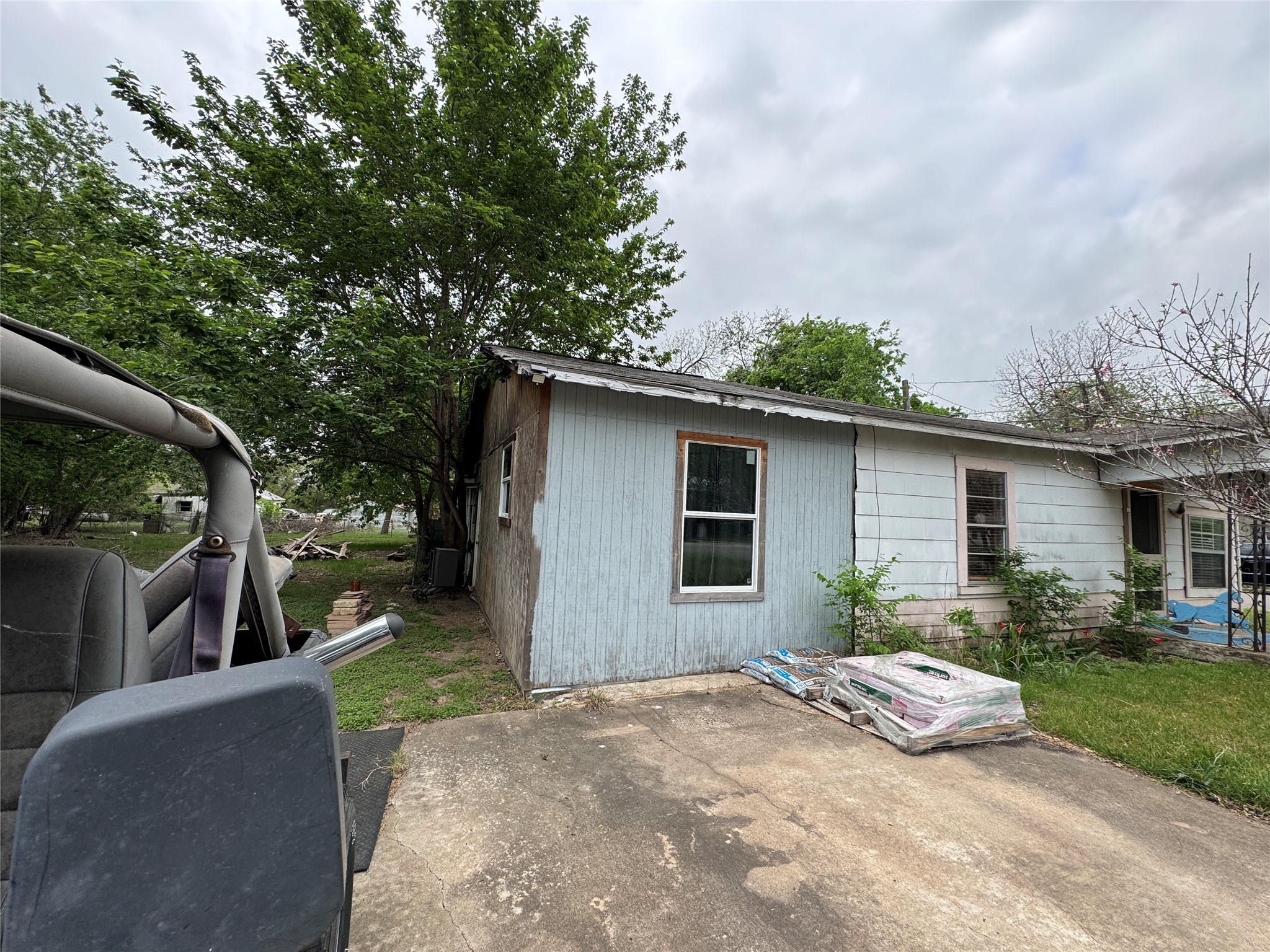 402 Laredo Street Lockhart, TX 78644 - Photo 4 of 12 a view of a house with a yard