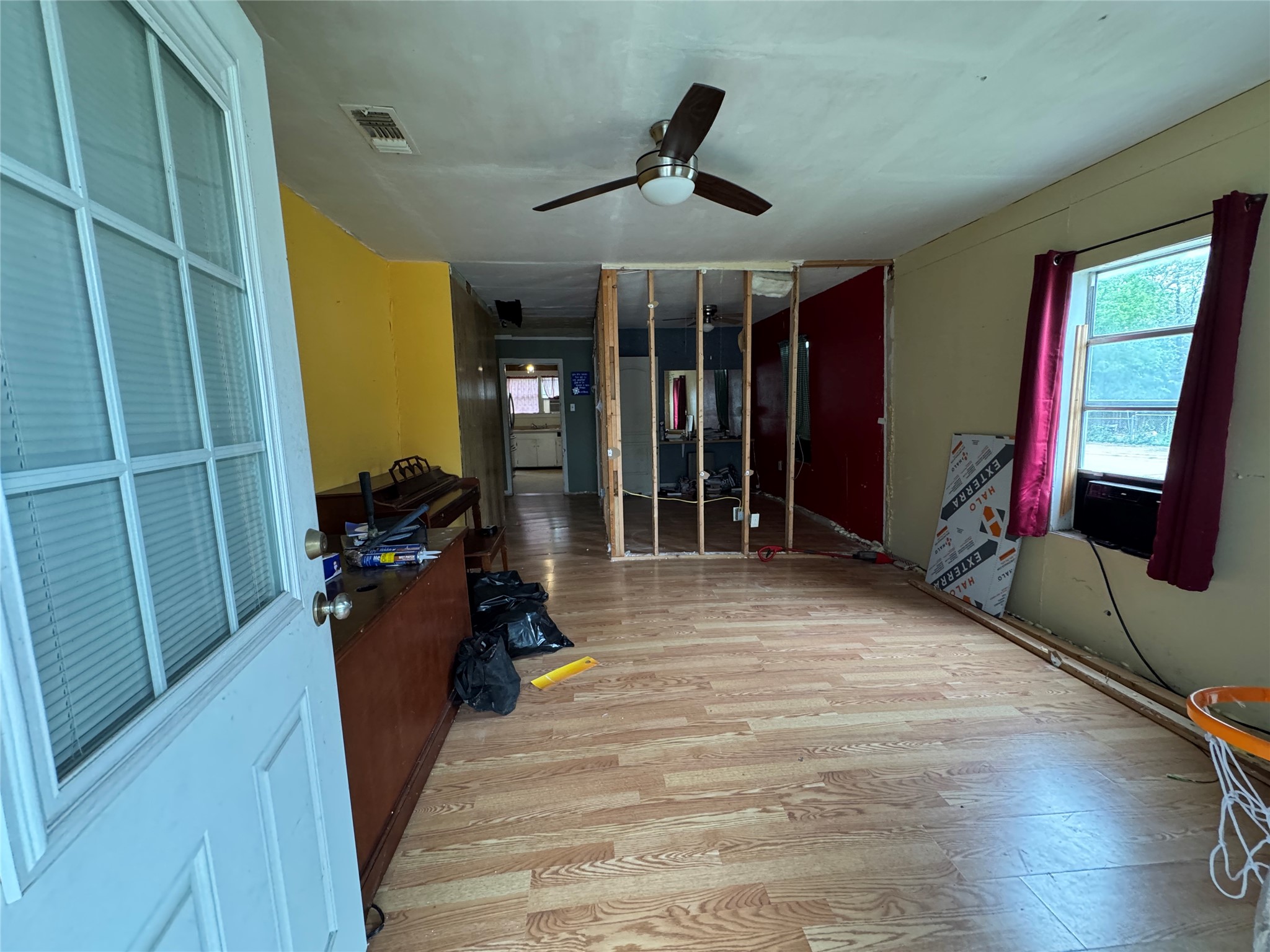 402 Laredo Street Lockhart, TX 78644 - Photo 5 of 12 a living room with furniture and a ceiling fan