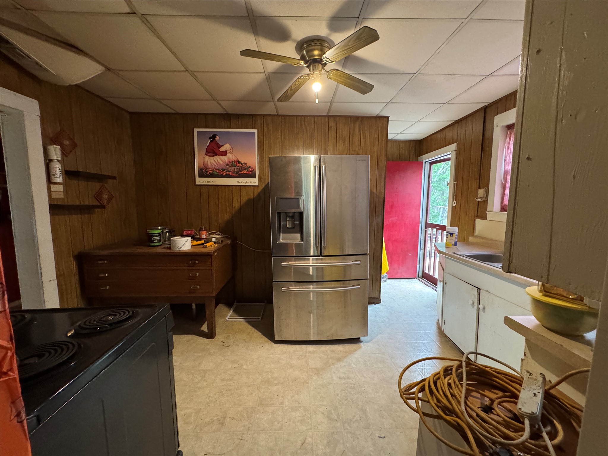 402 Laredo Street Lockhart, TX 78644 - Photo 9 of 12 a kitchen with refrigerator and cabinets