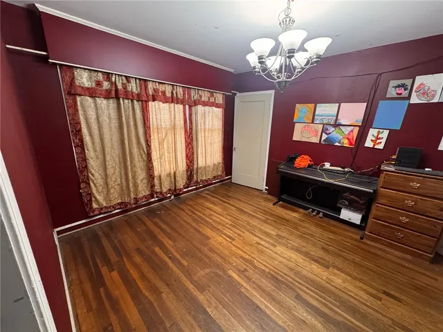 a view of a room with wooden floor and stairs