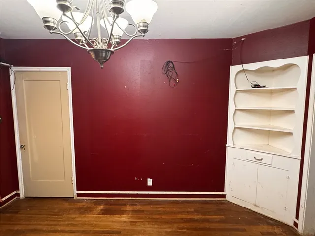 a view of a livingroom with wooden floor