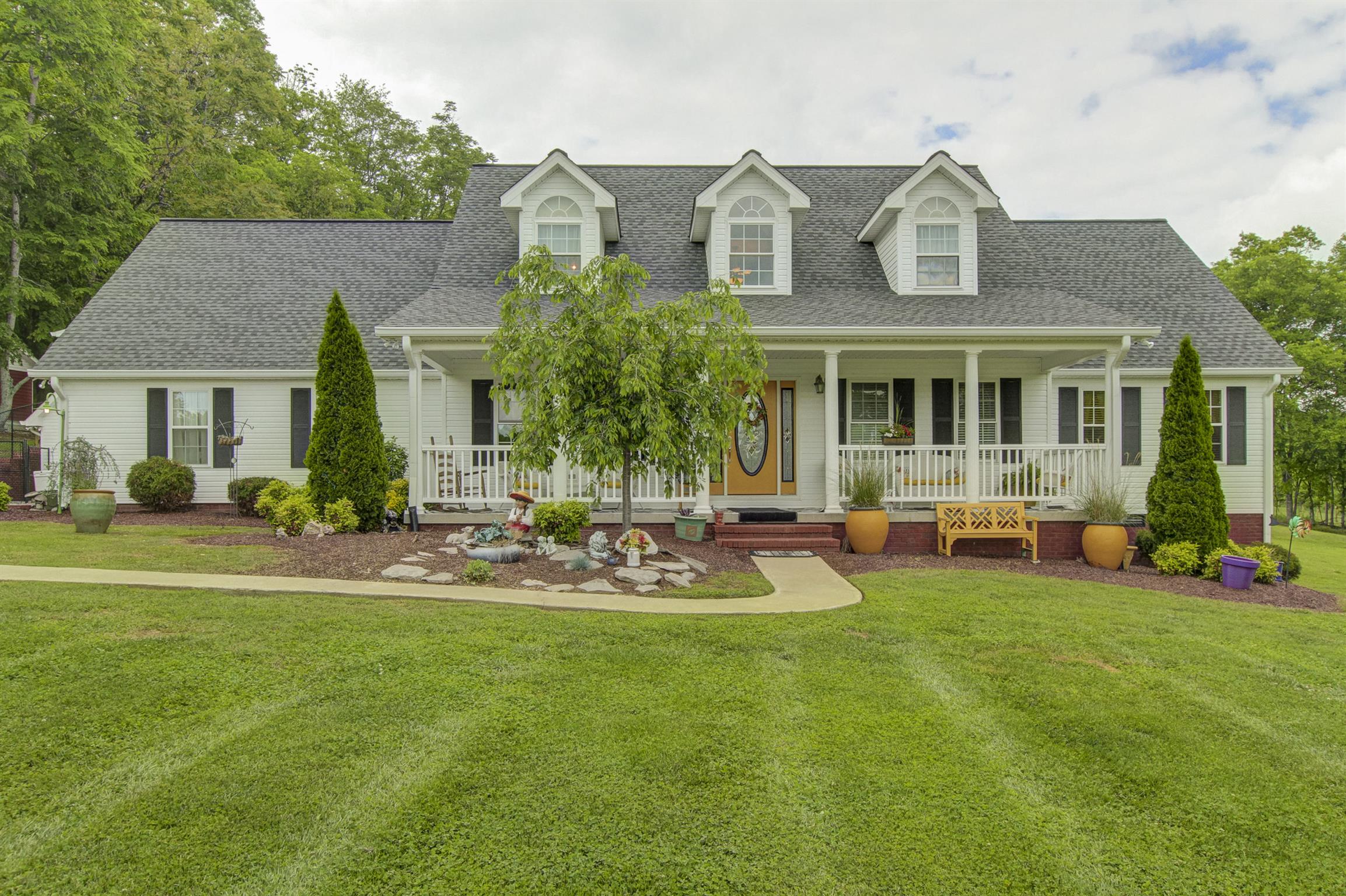 215 Buffalo Road Pleasant Shade, TN 37145 - Photo 1 of 30 front view of a house with a yard