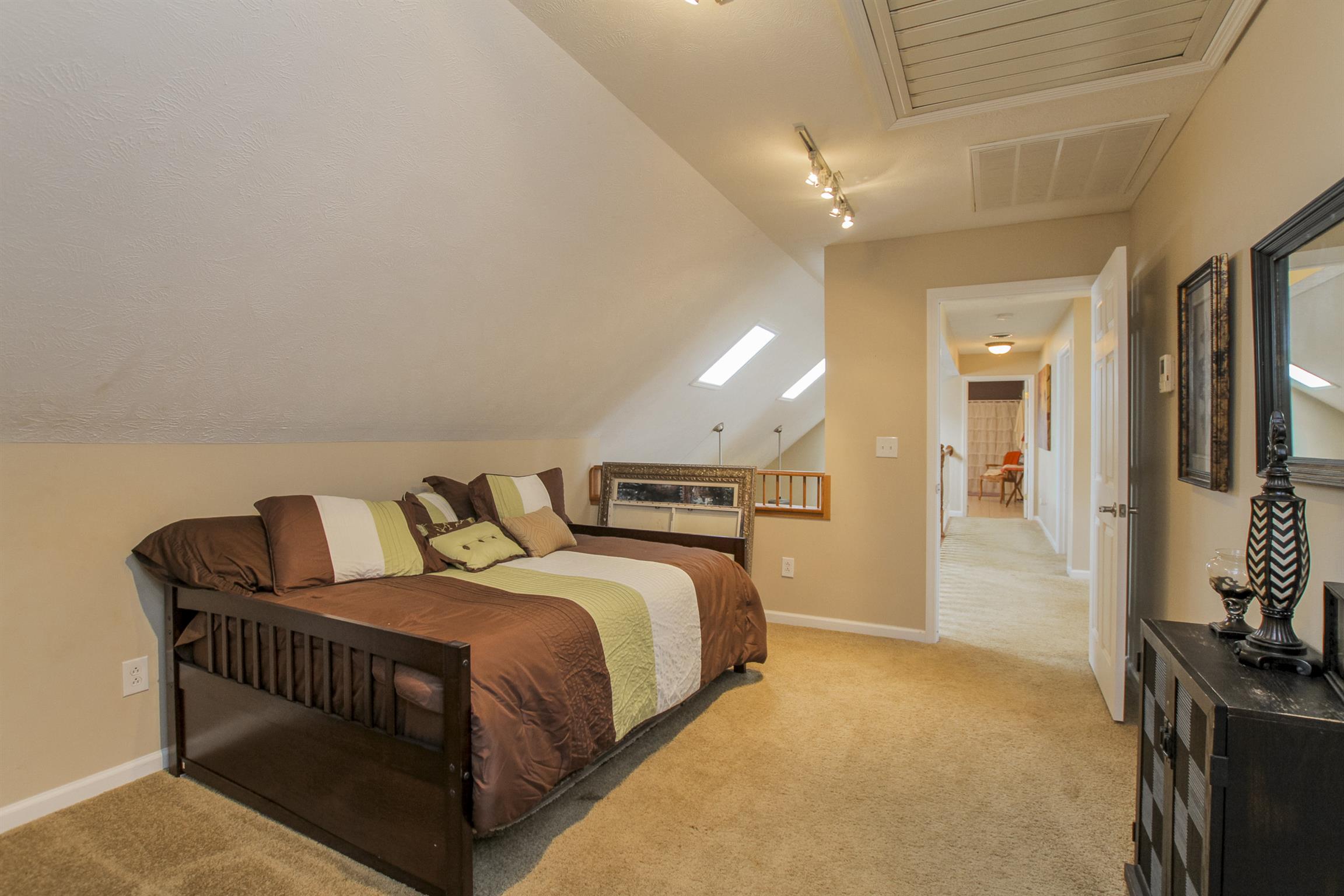 215 Buffalo Road Pleasant Shade, TN 37145 - Photo 20 of 30 a bedroom with a bed and a flat screen tv