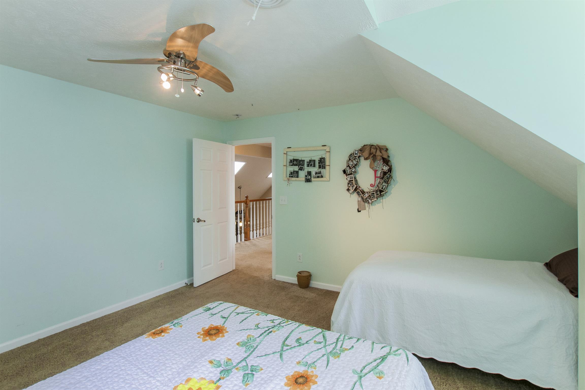 215 Buffalo Road Pleasant Shade, TN 37145 - Photo 23 of 30 a bedroom with a bed and a chandelier
