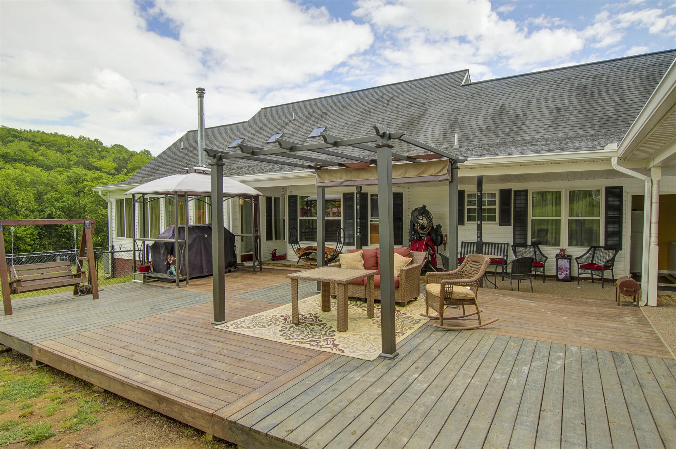 215 Buffalo Road Pleasant Shade, TN 37145 - Photo 3 of 30 a view of a dinning table and chairs in patio of the house