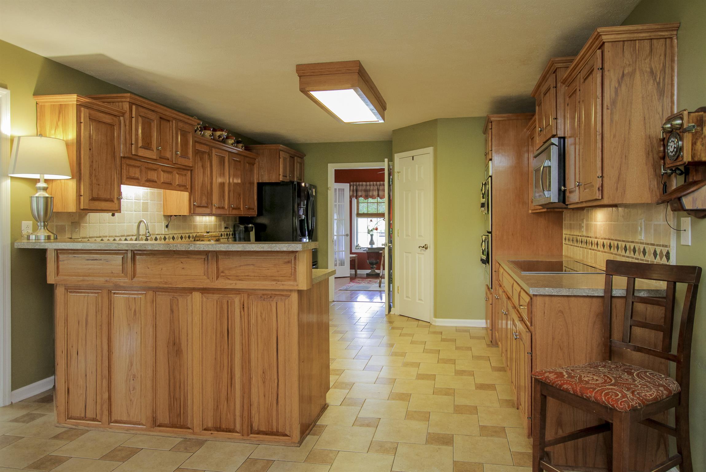 215 Buffalo Road Pleasant Shade, TN 37145 - Photo 9 of 30 a kitchen with stainless steel appliances granite countertop a sink and cabinets