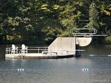 a view of a lake with houses in the back