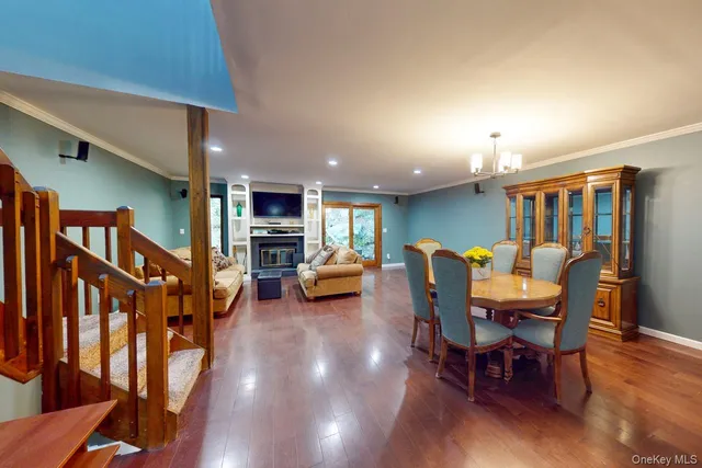 a view of a dining room with furniture and a livingroom