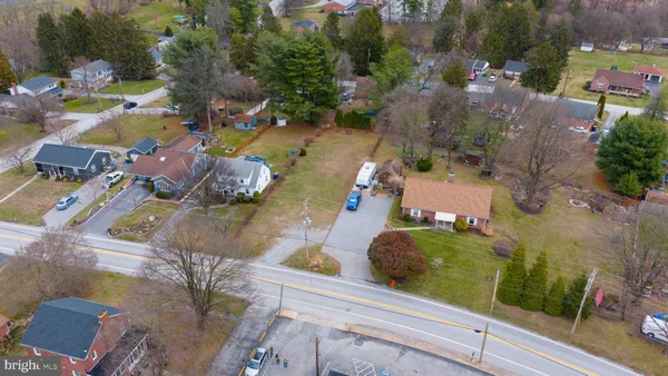 an aerial view of a house with outdoor space