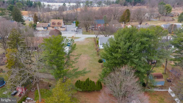 a backyard of a house with yard and outdoor seating