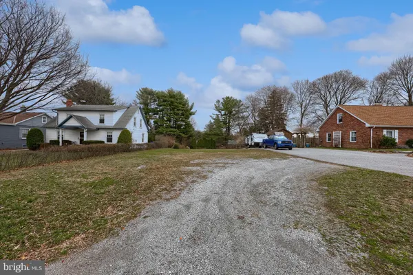 a view of house with outdoor space and street view
